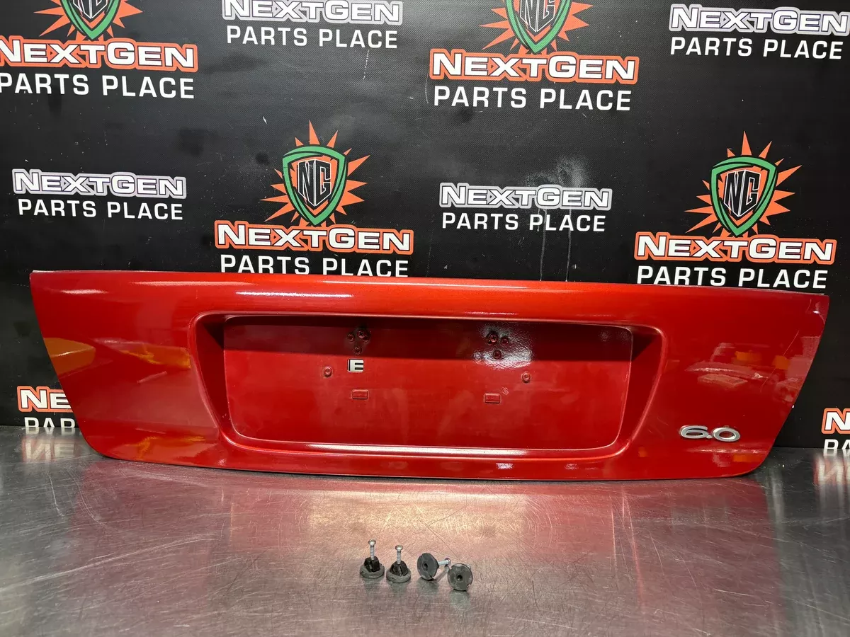 04-06 PONTIAC GTO LICENSE PLATE TRUNK FILLER PANEL SPICE RED OEM #1293
